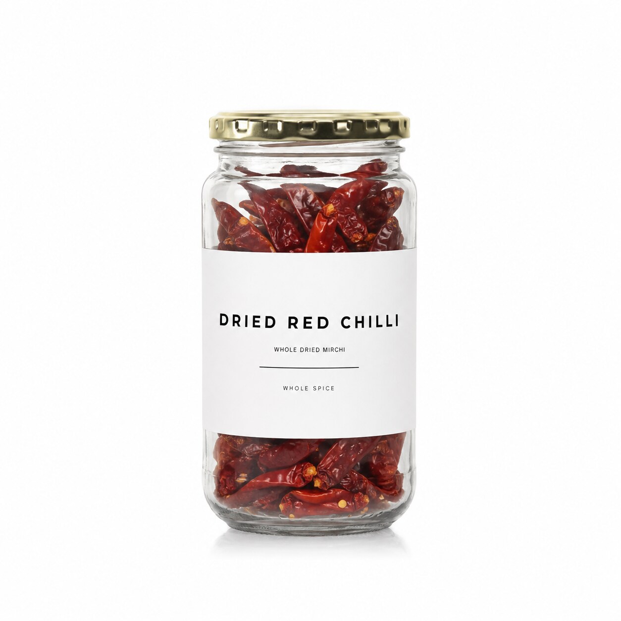 Whole dried red chillies in a Madame Masala glass jar